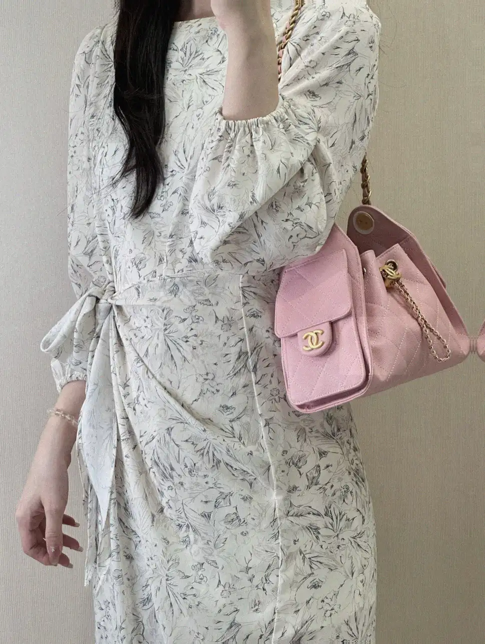 Counterfeit Chanel 25s small hobo drawstring bucket bag front view visual reference